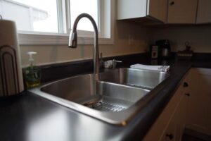 A kitchen counter with a double sink